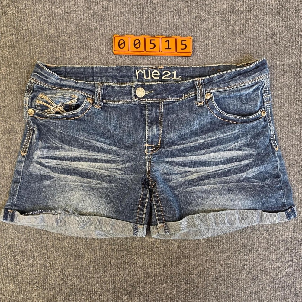 Rue 21 blue denim shorts with gold cross-stitch embroidery. Size 13 / 14